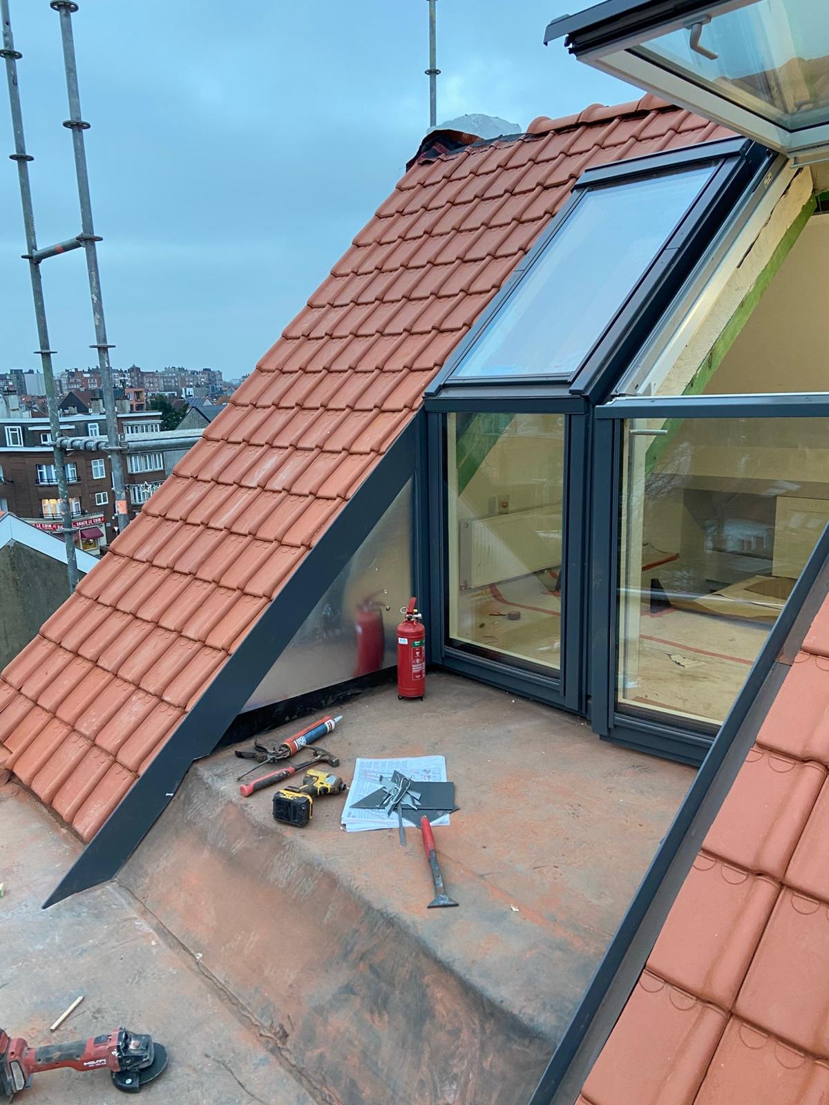 Finished dormer and roof window on a tiled roof