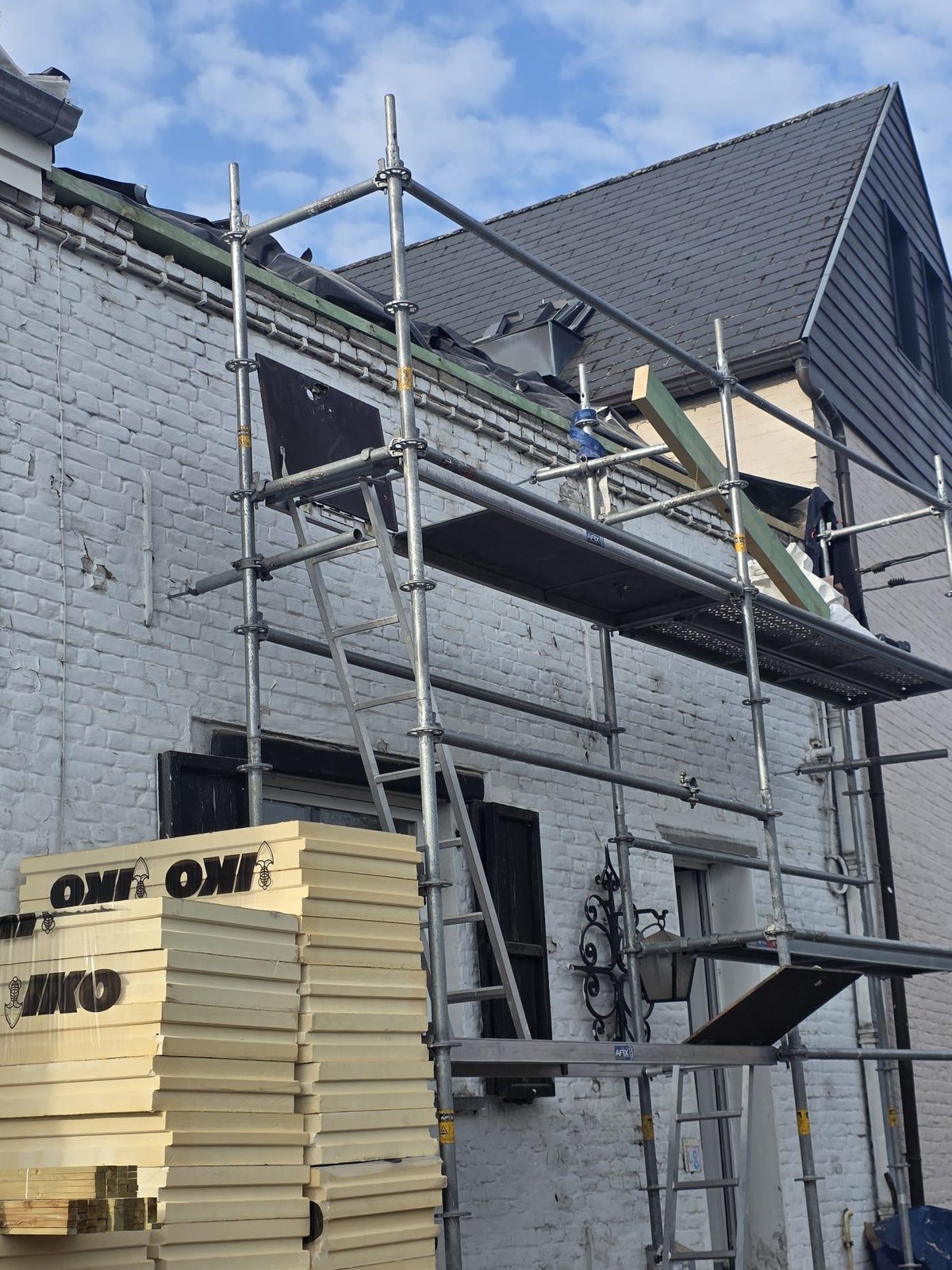 External roof insulation site, insulation panels delivered