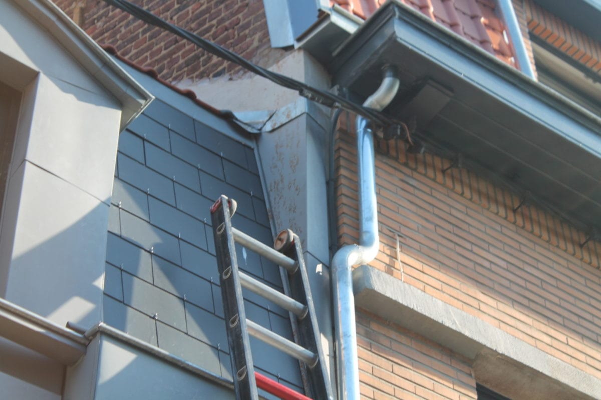 Zinc gutter on a slate-clad facade