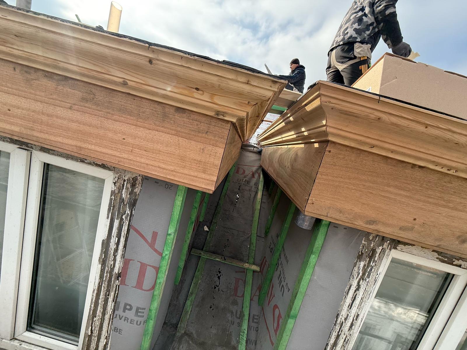 Dormer with wood cladding and renovated cornice