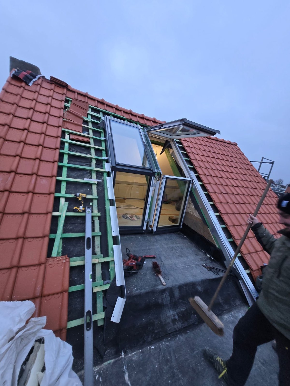 Roof window installation in progress, exterior view